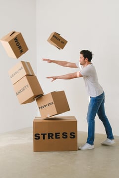 Free Full body of young man in sneakers and jeans pushing and falling boxes saying Work Problems Anxiety Stress and Deadline while fighting with problems Stock Photo